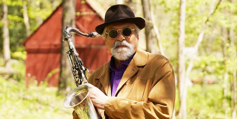 Colour portrait of Joe Lovano with saxophone