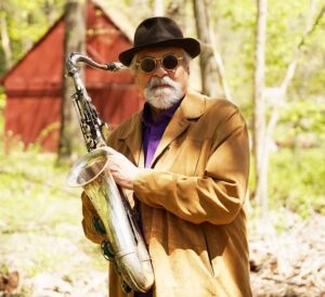 Colour portrait of Joe Lovano with saxophone