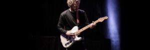 Colour photo of musician Jakob Bro playing guitar